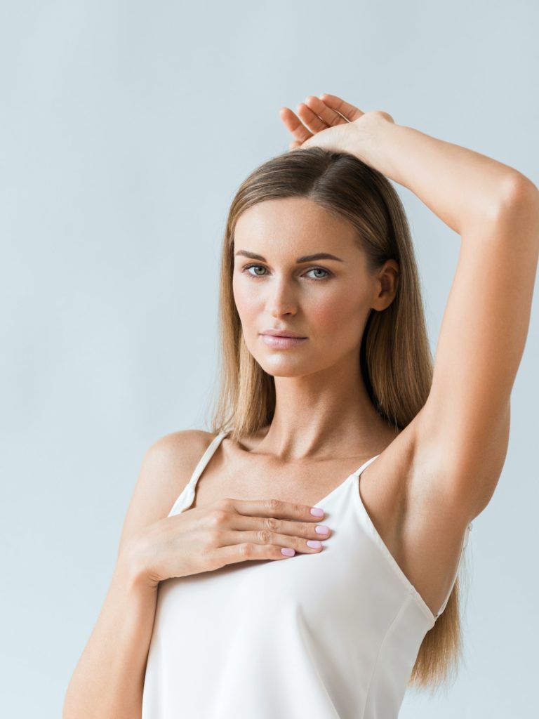 Woman showing smooth underarm skin